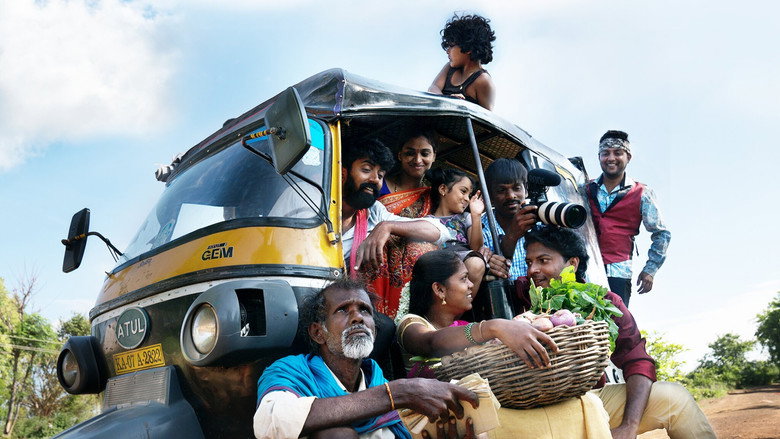 A rickshaw driver and his friends huddle around a camera, their faces lit with a mix of curiosity and mischief