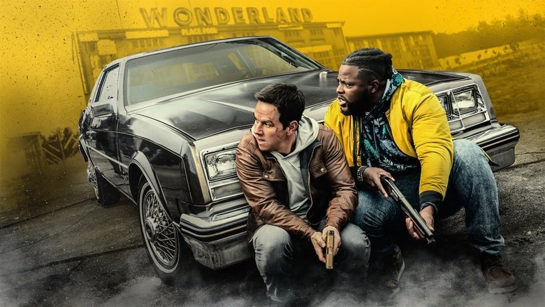 Mark Wahlberg and Winston Duke standing in a dimly lit boxing gym, the latter holding a pair of gloves
