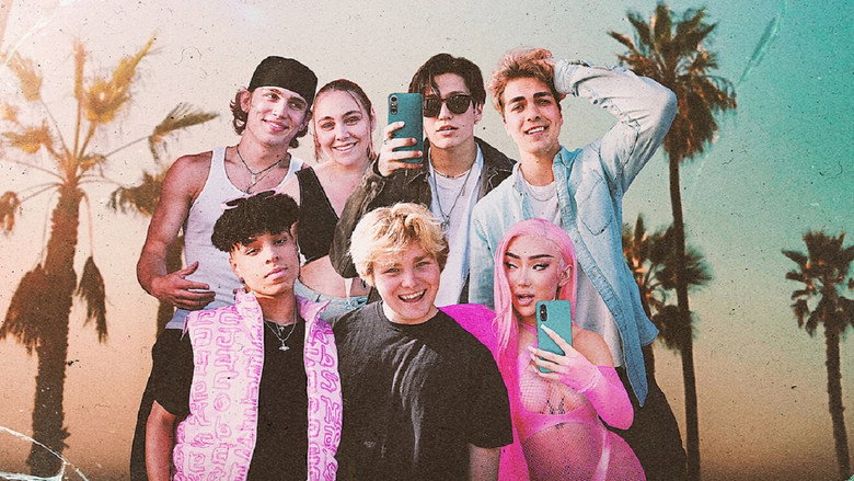 A dimly lit room where a group of young influencers huddle around a phone, their faces illuminated by the screen’s glow