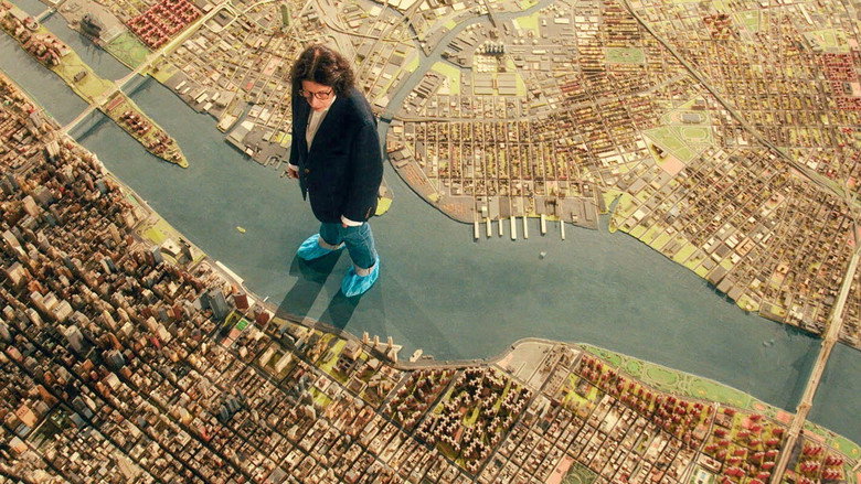 Fran Lebowitz and Martin Scorsese in conversation, a subway map blurred in the background