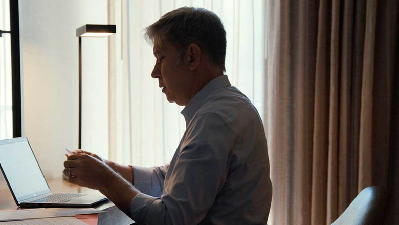 A parent standing in a doorway looking into a child's room