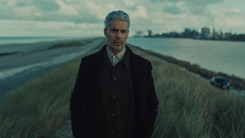 A tense standoff in a dimly lit hallway