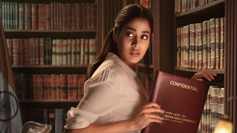 A dimly lit room where Suhana Bhatia stands in front of a window, her reflection fractured by the rain-streaked glass.
