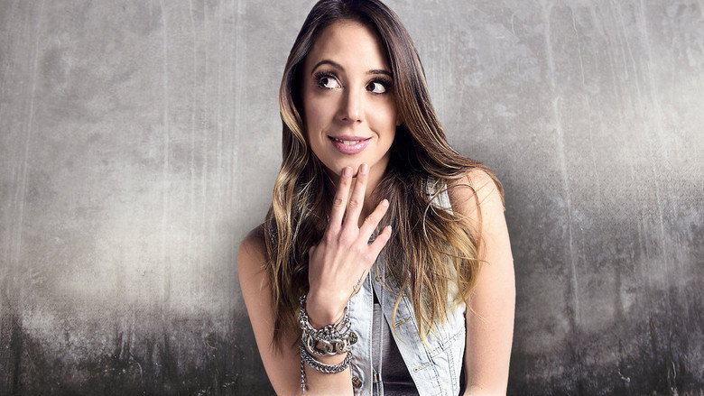Sofía Niño de Rivera performing on stage, mid-gesture, under warm stage lighting