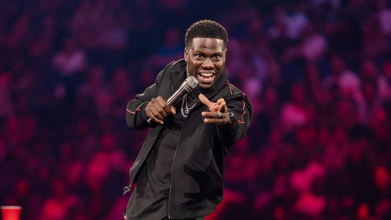Hart on stage, mid-laugh, the spotlight catching the sweat on his forehead