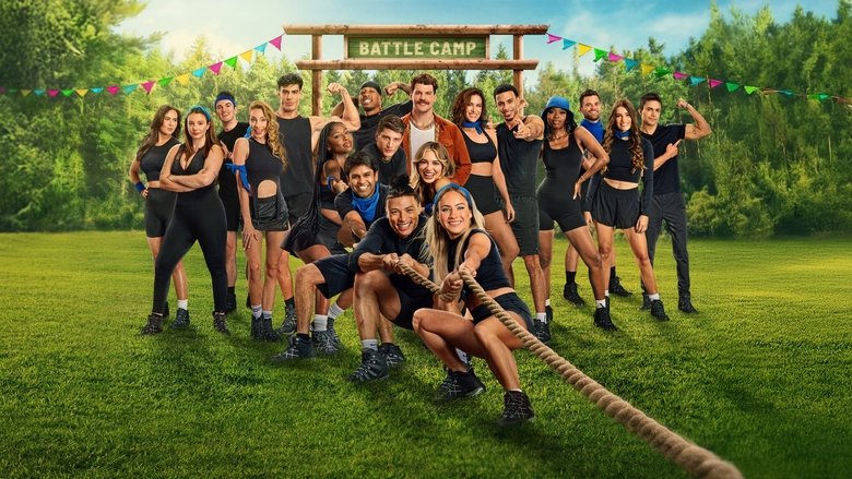 A contestant mid-fall in a muddy challenge, arms flailing, while others watch from the sidelines