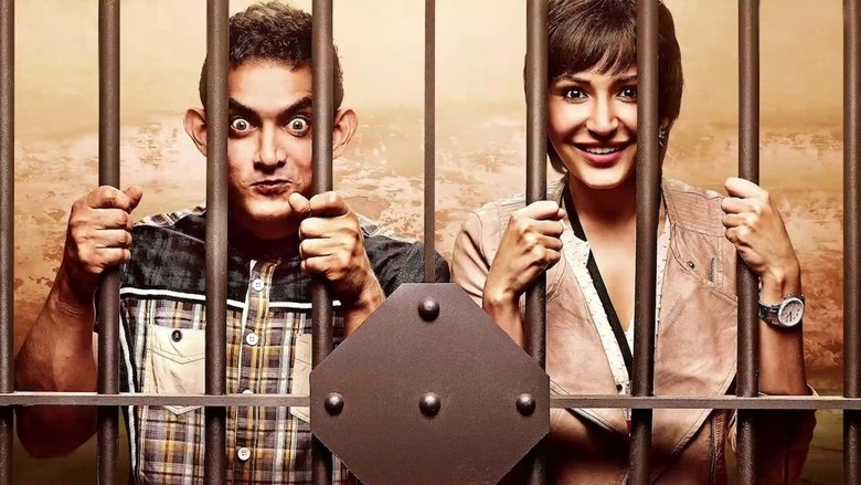 PK, the alien, standing in a crowded Indian street, his face a mix of confusion and awe as he watches people bow before a statue