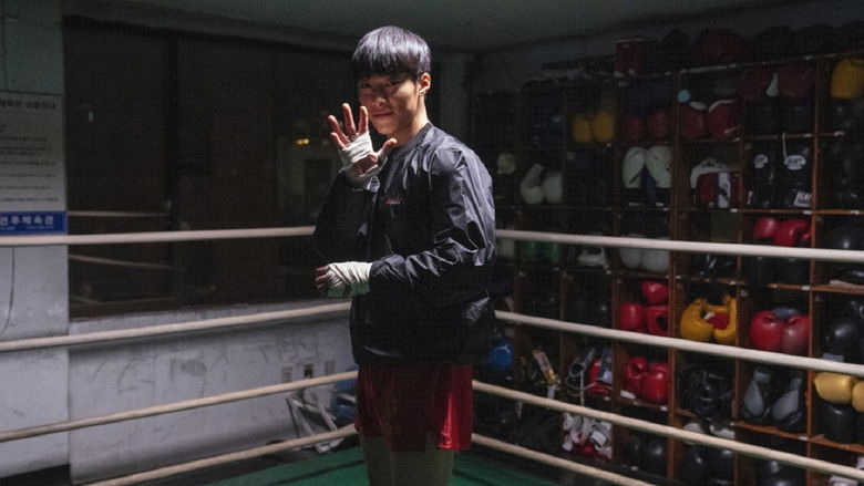 Gun-woo looking out over the neon-lit Seoul skyline