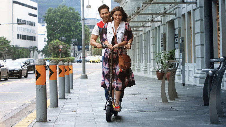 A vibrant song sequence with Varun Dhawan and Alia Bhatt dancing in traditional attire against a colorful backdrop