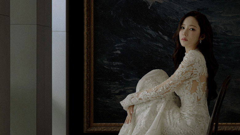 An elegant, dimly lit art auction room with cold, blue-toned lighting