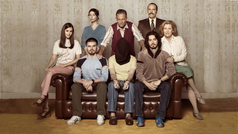 A dimly lit dining room, the family gathered around a table, their faces half in shadow
