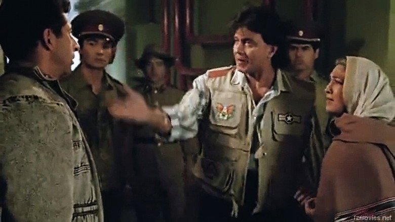 A tense standoff in a snowy landscape, the camera low to the ground, emphasizing the vastness of the setting and the isolation of the characters.