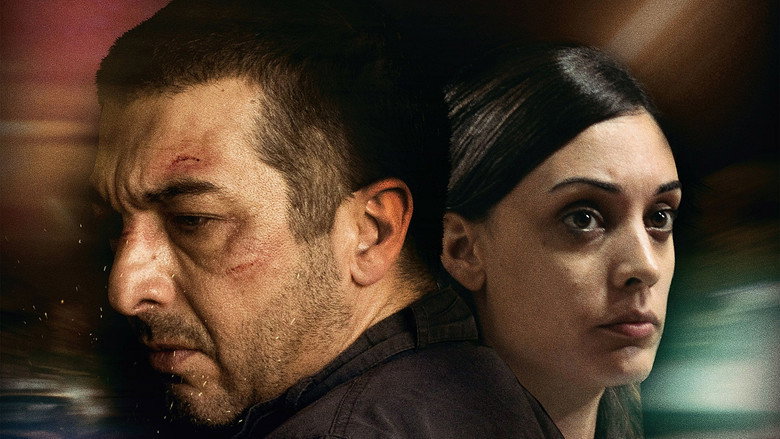 A close-up of two faces pressed together in the backseat of a car, the world outside blurred and chaotic, their expressions caught between tenderness and terror.