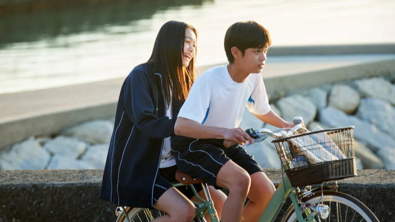 Takagi and Nishikata sitting side by side on a sunlit bench, the ocean stretching behind them, neither looking at the other but both leaning just a little too close.