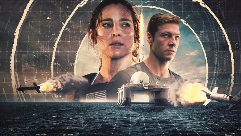 Elsa Pataky stands in the control room of the missile interceptor base, her face lit by the glow of monitors, tension etched in her posture.