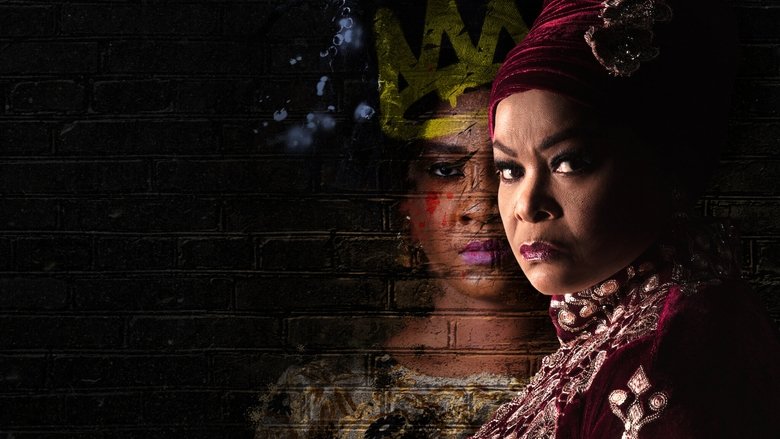 A dimly lit room where Alhaja Eniola Salami sits at a table, her expression unreadable, the glow of a cigarette casting shadows on her face