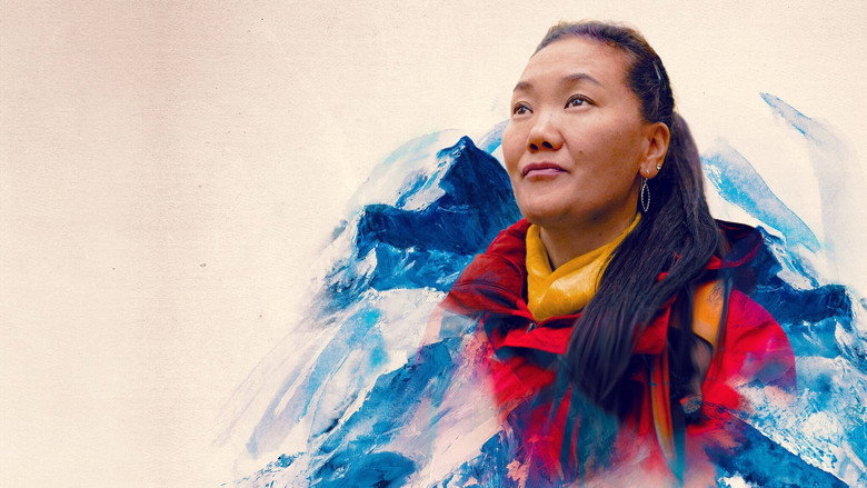 Lhakpa Sherpa, bundled in climbing gear, gazes upward at the Everest summit ridge, her face half-hidden by an oxygen mask.