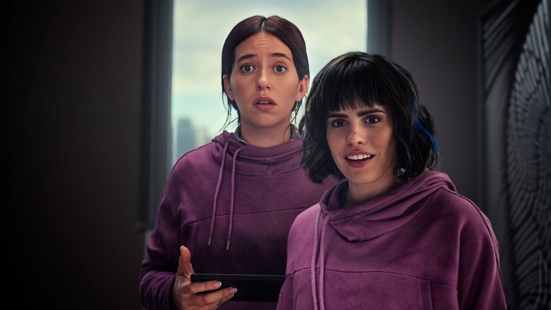Two sisters stand in a dimly lit apartment, staring at a wall that’s been pried open to reveal stacks of cash.