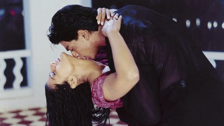 A moment of quiet between Rahul and Anjali, the rain blurring the lines between friendship and something more
