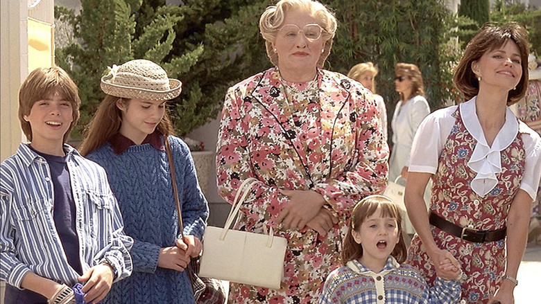 Daniel Hillard watching his family from the kitchen