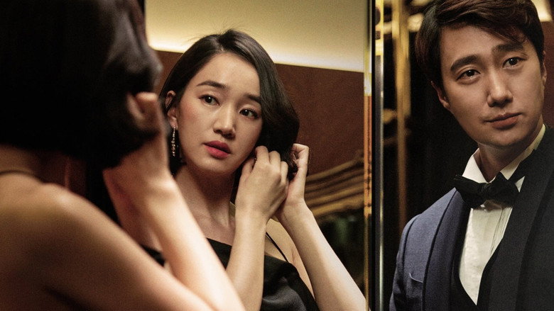 A dimly lit room where the couple stands apart, their reflections fractured in a gilded mirror