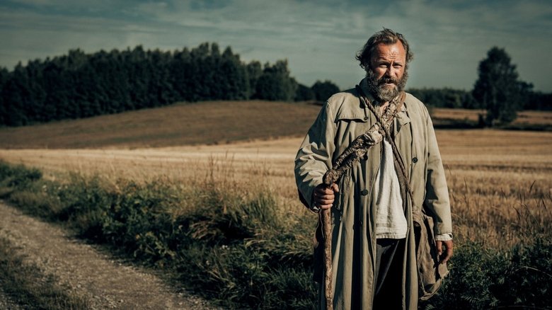 The protagonist, Rafal Wilczur, navigating his new, humble life