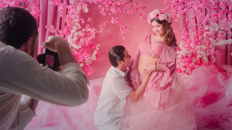 Alejandra adjusts the padding under her dress, her reflection caught in a hospital mirror.