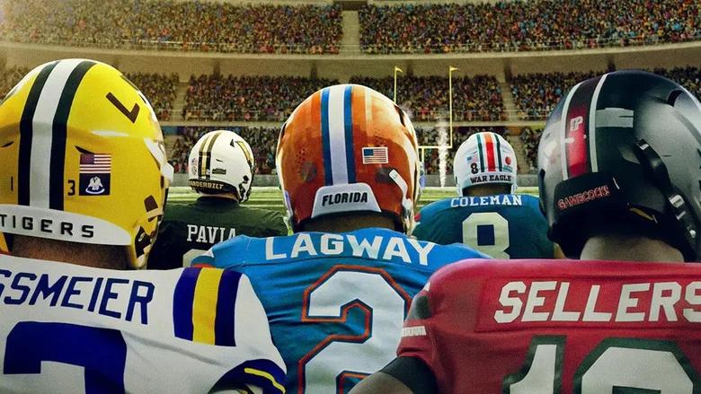 A coach in a headset, mid-sentence, his face lit by the glow of a playbook screen