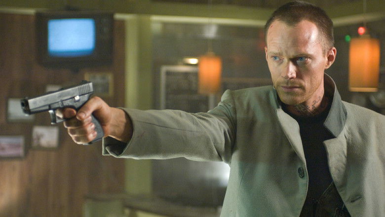 Paul Bettany's character, the Archangel Michael, looking grim with a weapon in hand.