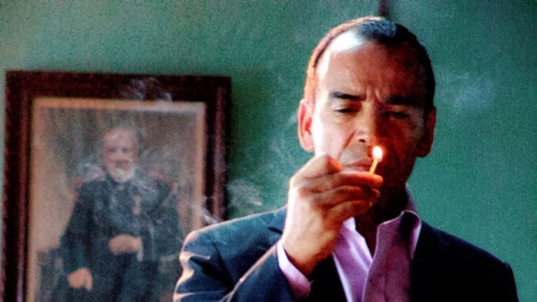 A dimly lit room, the camera lingering on a character’s face half-hidden in shadow, their expression unreadable.