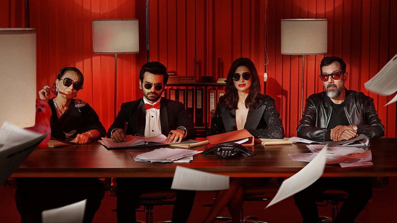 The agents huddle around a desk, scripts and phones in hand, as the chaos of a Mumbai talent agency unfolds.