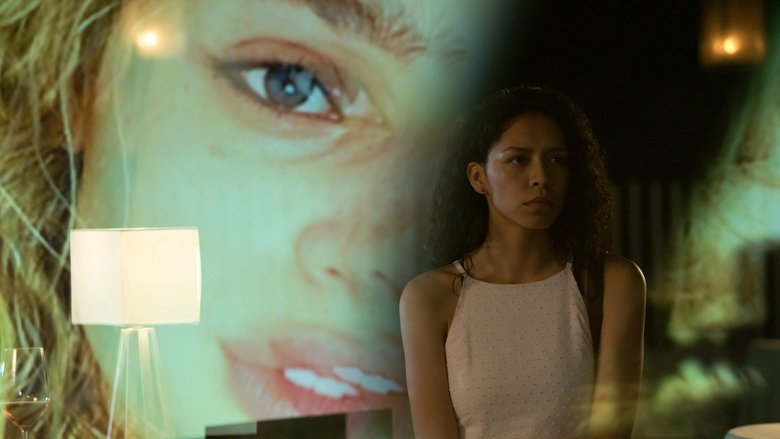 A dimly lit bedroom, shadows stretching across the walls, as Sasha Yazzie wakes from a nightmare, her face half-lit by the glow of a bedside lamp.