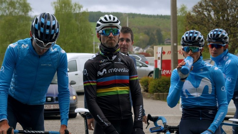 A tense moment in the team car, riders and directors huddled in heated discussion
