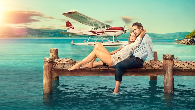 A seaplane soars over turquoise waters, the Whitsunday Islands stretching below like a scattered handful of emeralds.