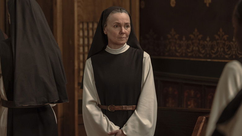 A close-up shot focusing on the character's hands and subtle facial tension