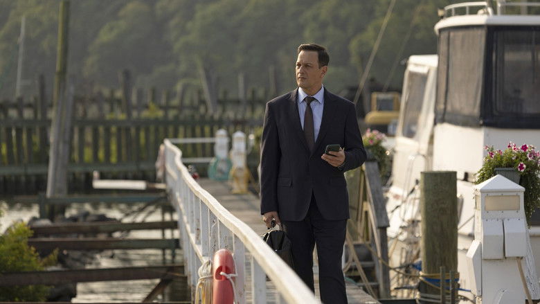 Louisa and Martin sharing a tense, unspoken moment by the water