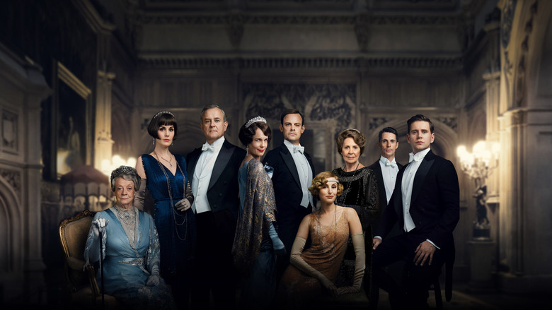 The grand staircase of Downton Abbey, bathed in golden light, with servants lined up in quiet anticipation