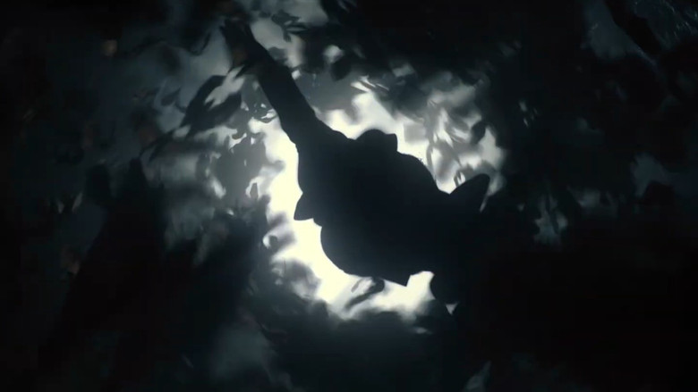 The Batmobile firing weapons in a chase