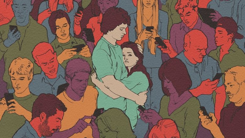 A teenager illuminated only by the blue glow of a computer screen in a dark bedroom