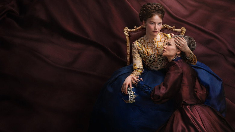 A candlelit ballroom where Elisabeth, in a deep emerald gown, stands apart from the crowd, her expression caught between defiance and exhaustion