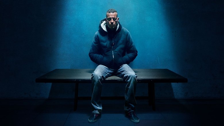 Stefano Cucchi lies on a hospital bed, his body gaunt and bruised, as his sister Ilaria touches his arm with quiet devastation.