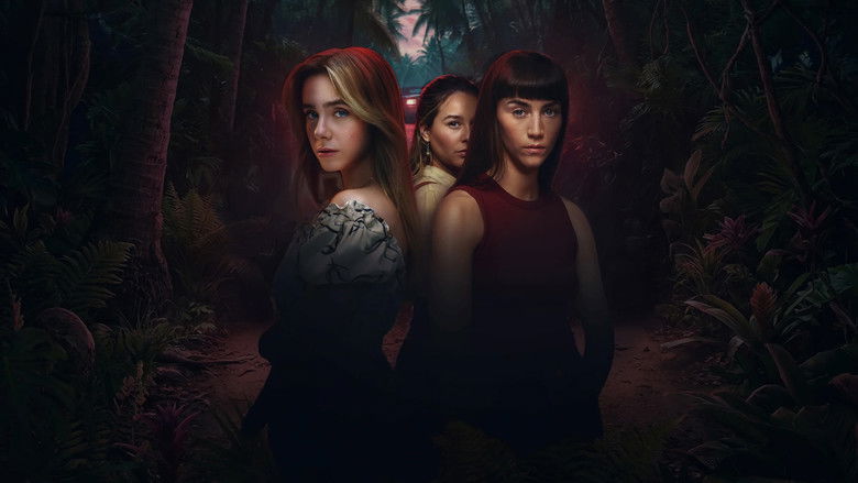 The main character, a young woman, looking out at a dark ocean from a hotel balcony.