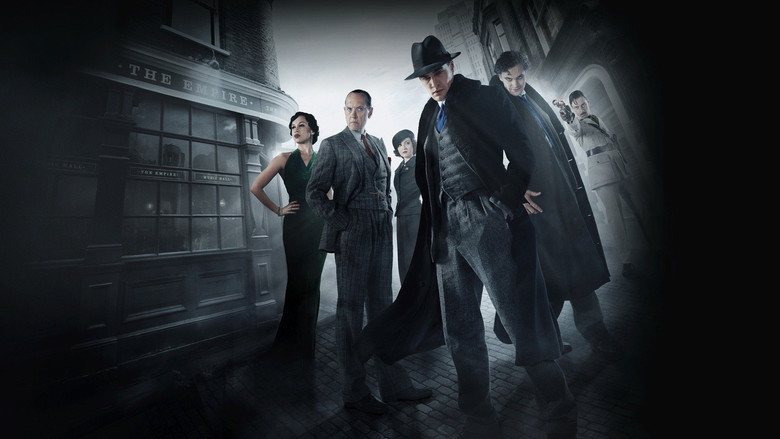 A shadowy figure stands in the glow of a gas lamp, the fog curling around his feet like a living thing.
