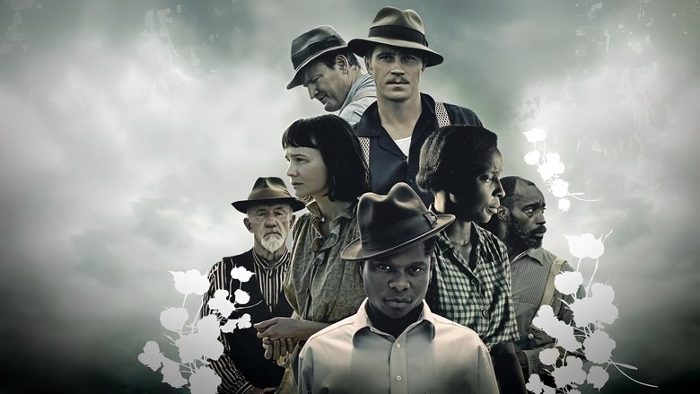 The Jackson family walking through the muddy fields, their figures small against the vast, unforgiving landscape.