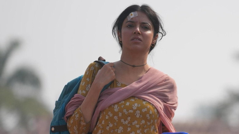 A tense confrontation in a dimly lit room, where Mamta clutches the stolen phone while Abhishek looms over her, his expression a mix of fury and calculation.