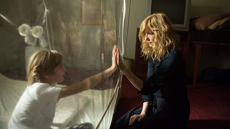 The fogged window of the clean house, where the name "ELI" appears backward, spelling "LIE."