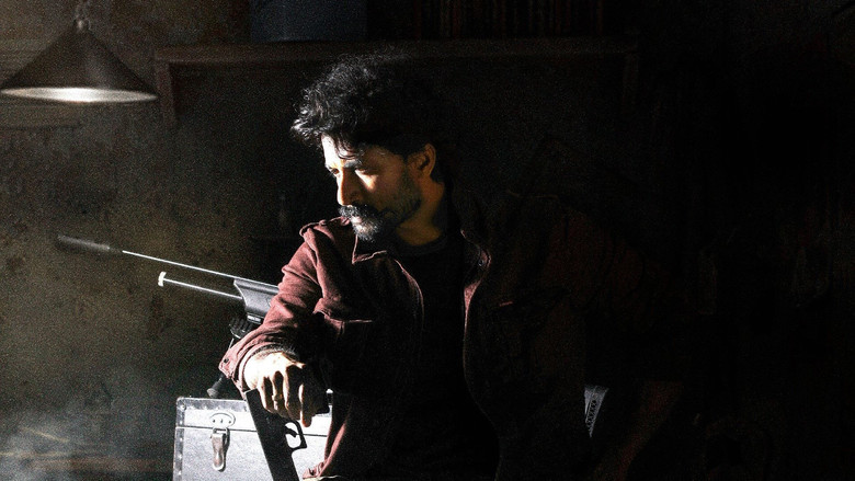 A tense negotiation scene, with Vyshali (Aishwarya Lekshmi) standing in a dimly lit room, her face half in shadow, as she speaks into a phone.