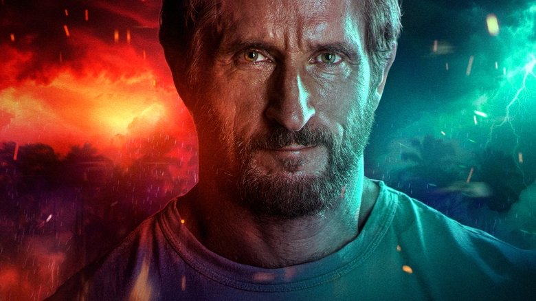 A tense tribal council scene where the contestants are silhouetted against a firelight background.