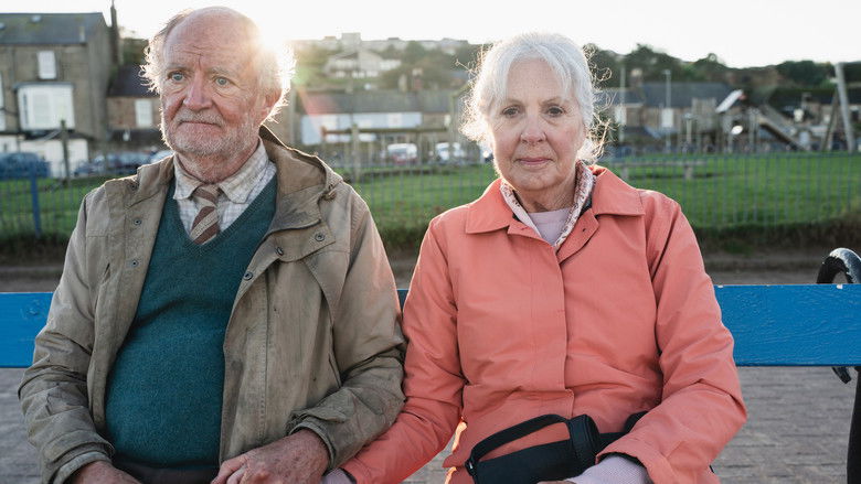 Harold and his wife Maureen standing in their garden, separated by a visual barrier
