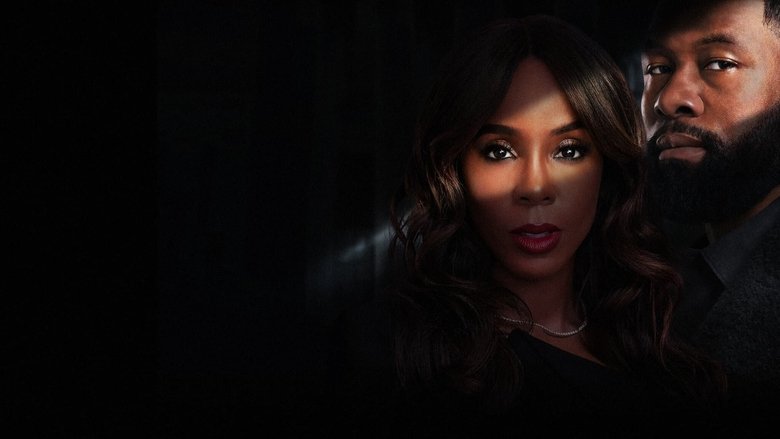 Kelly Rowland and Trevante Rhodes in a dimly lit room, their faces half in shadow, the tension between them thick enough to cut with a knife.